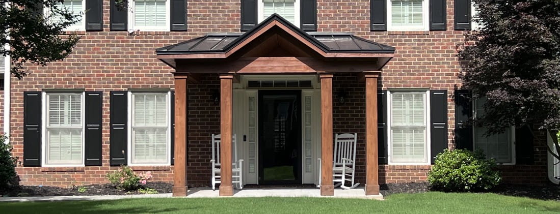 A Portico Makes the Perfect Covered Entryway for Storm Season (Roswell-GA-front-portico-for-two-story-traditional-brick)