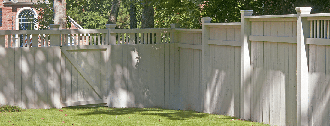 An original ADF photograph showing a completed privacy fence in the context of a Georgia-area backyard
